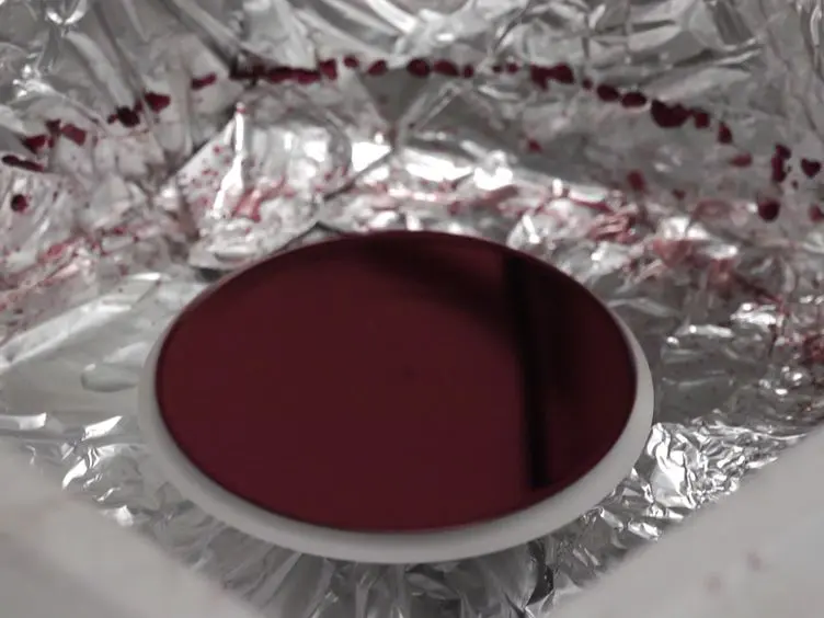 Origami Inspired Self-assembly of Patterned and Reconfigurable Particles