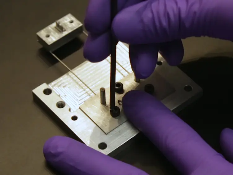 A Millimeter Scale Flexural Testing System for Measuring the Mechanical Properties of Marine Sponge Spicules