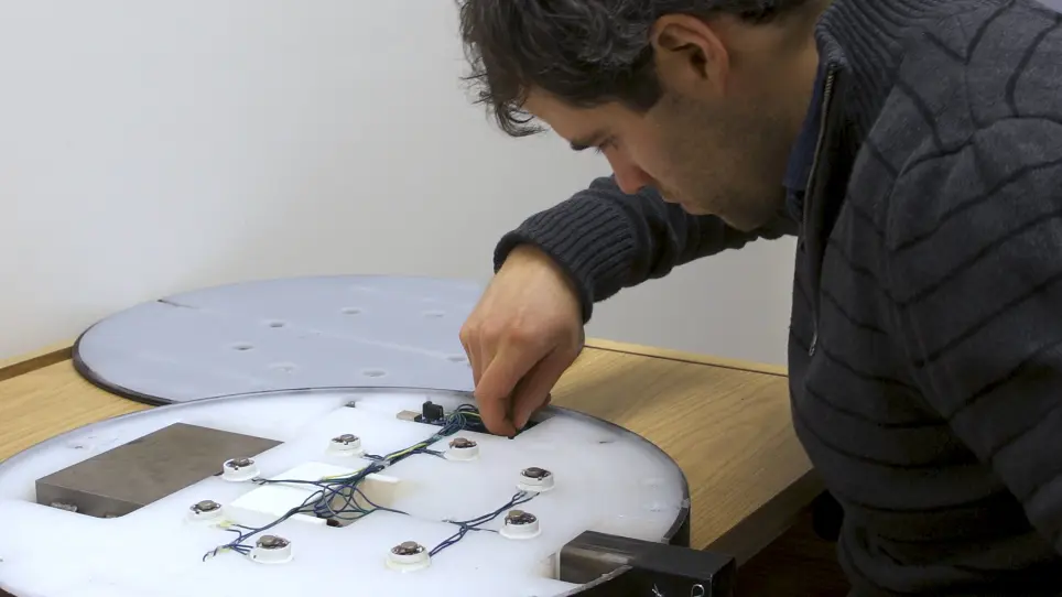 A Vibrotactile Feedback Device for Seated Balance Assessment and Training