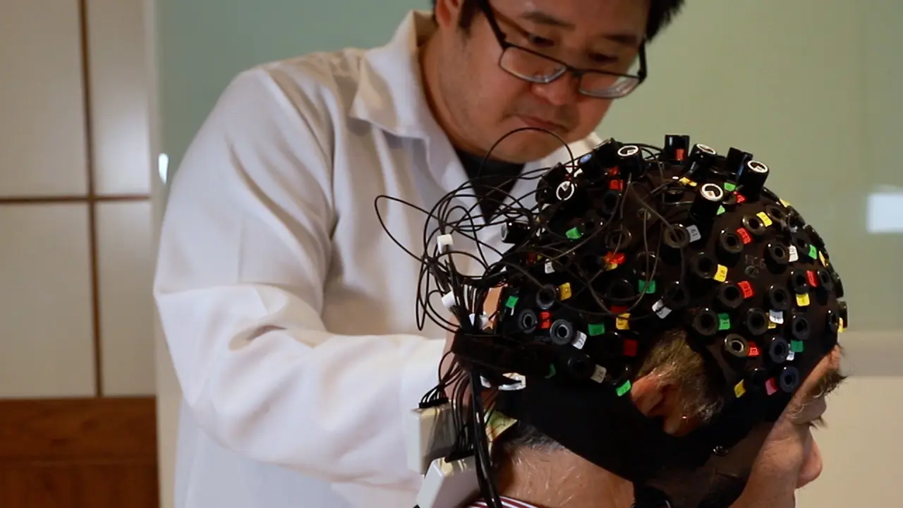 An Experiment Using Functional Near-Infrared Spectroscopy and Robot-Assisted Multi-Joint Pointing Movements of the Lower Limb