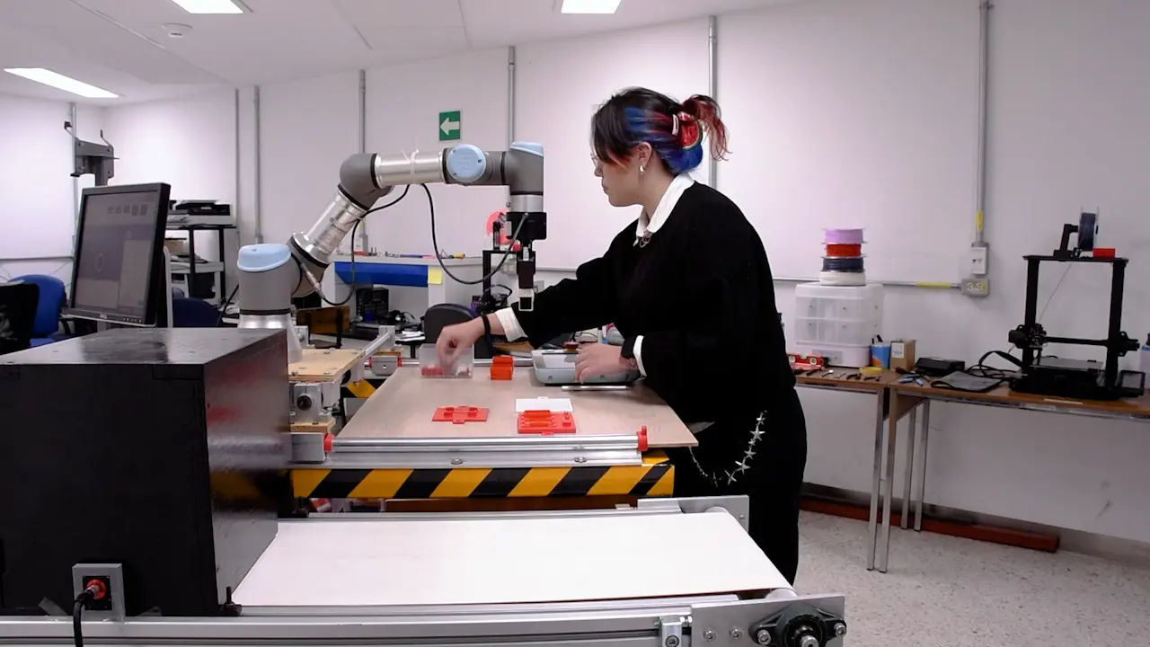 Simulation of a Scaled Assembly Process with Collaboration of a Robotic Arm and Monitoring through a Vision System for Quality Control