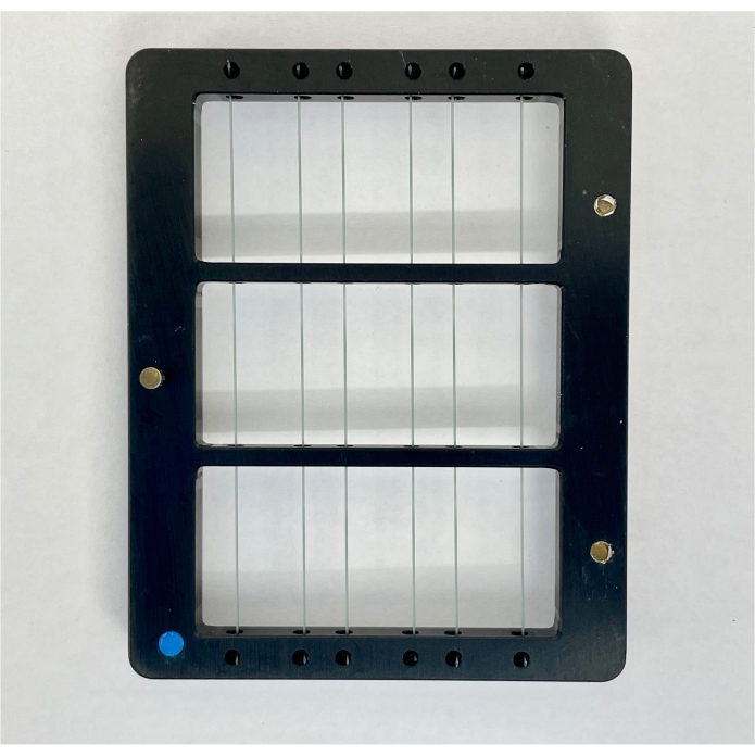 Electrophoresis gel comb in frame, setup for DNA separation experiment, lab equipment.